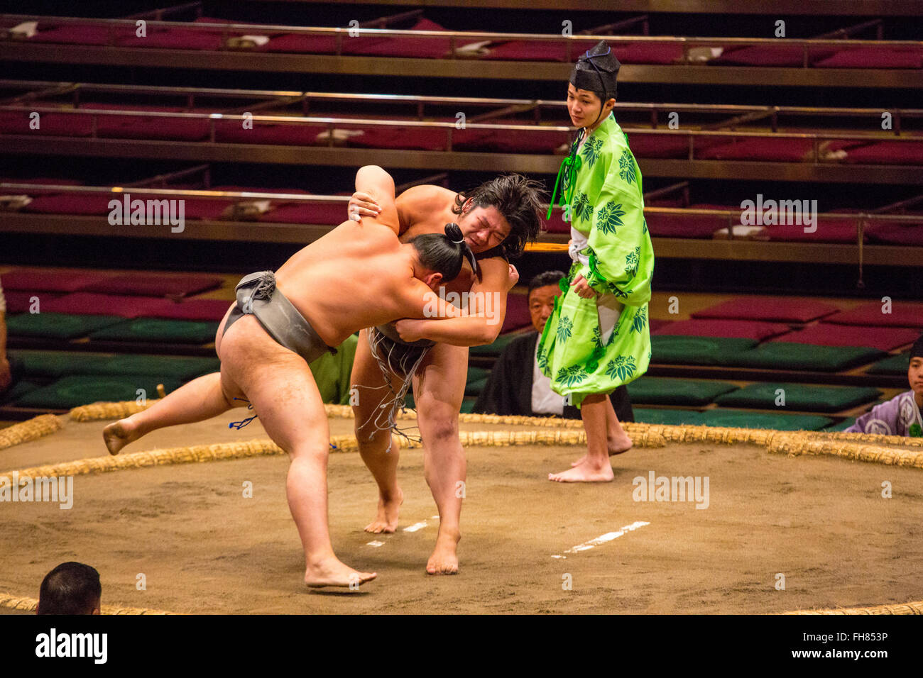 Two Sumo wrestlers fight it out in Tokyo Stock Photo