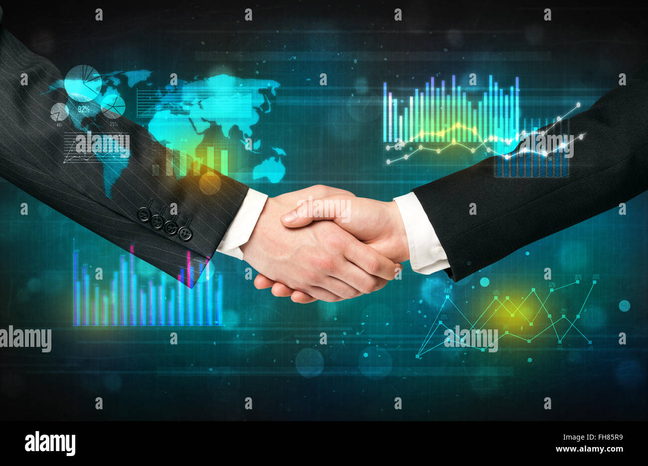 Handshake with diagrams Stock Photo Alamy