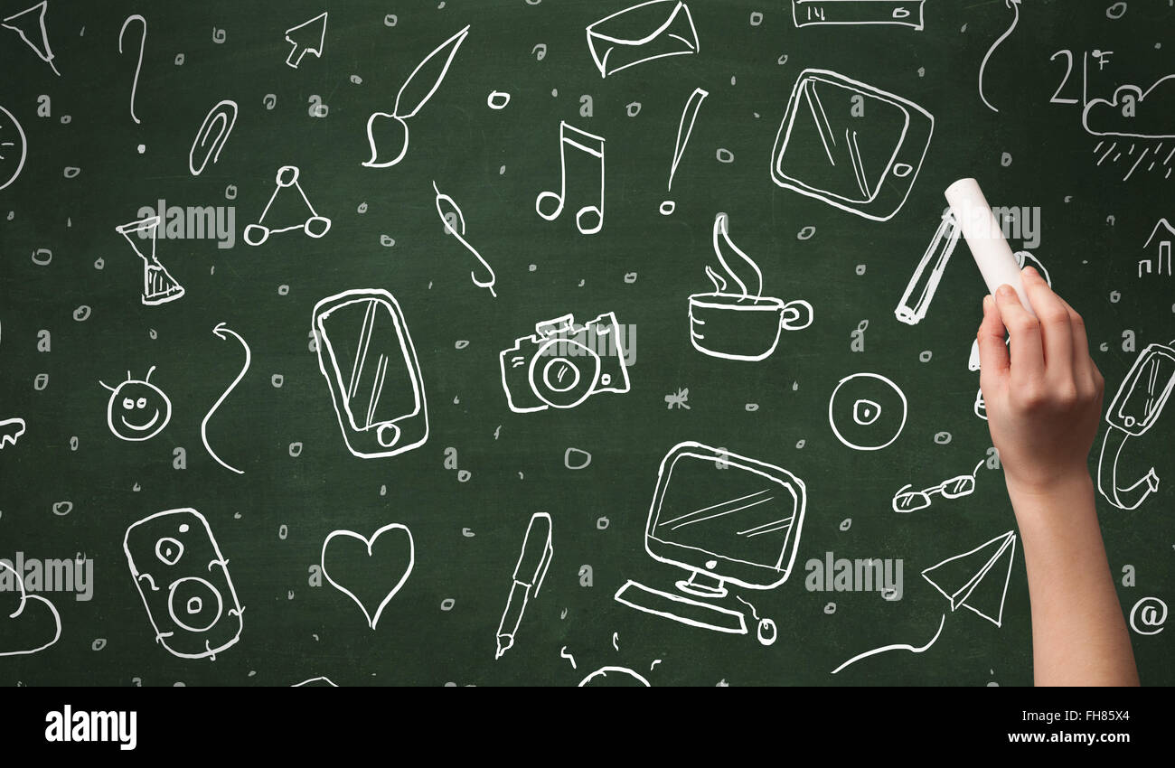 Hand writing icons on blackboard Stock Photo - Alamy