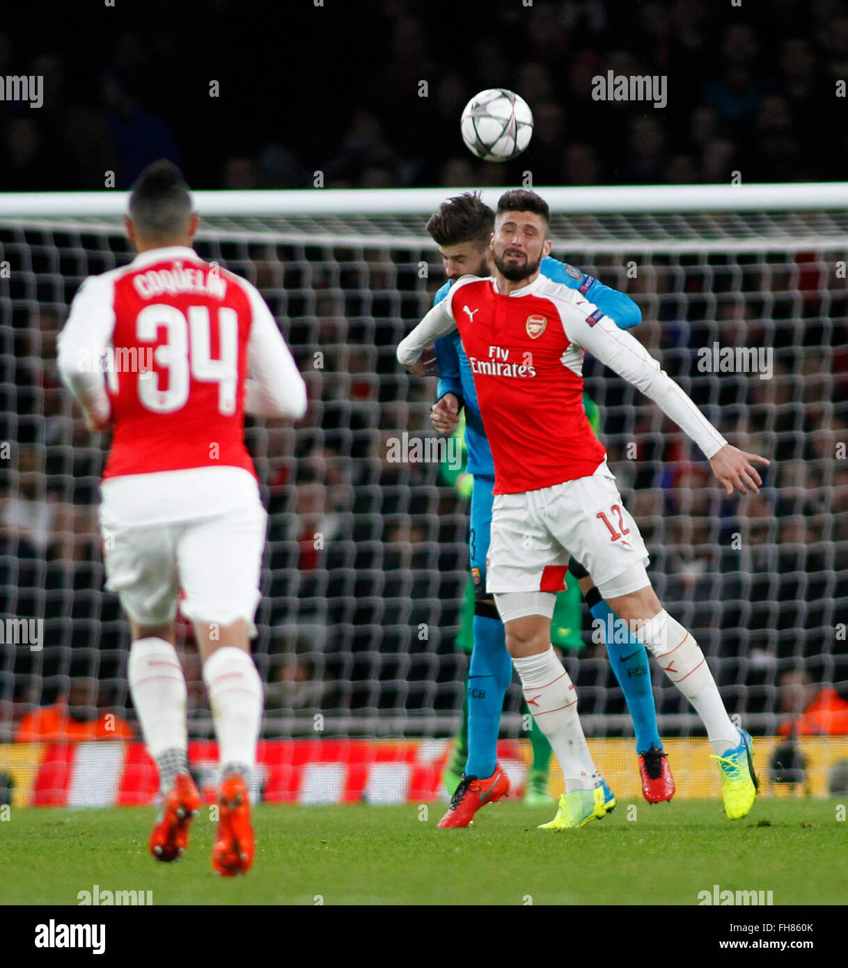 London, UK. 23rd Feb, 2016. Gerard Pique of Barcelona and Olivier Giroud of Arsenal compete for the ball during the Champions League match between Arsenal and Barcelona at The Emirates Stadium on February 23, 2016 in London, United Kingdom. Credit:  Mitchell Gunn/ESPA/Alamy Live News Stock Photo