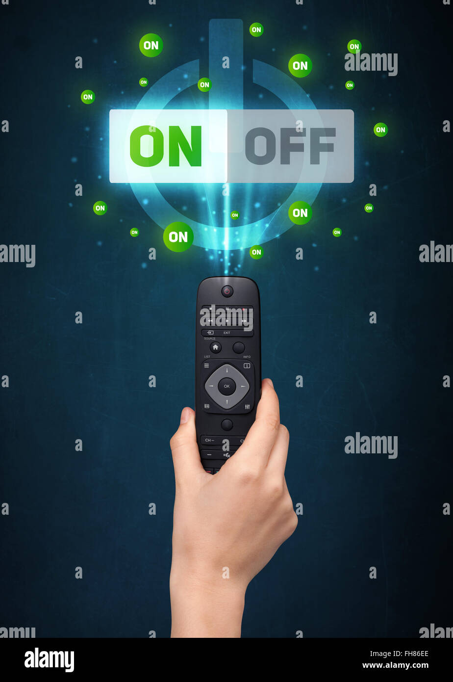 Hand with remote control and on-off signals Stock Photo - Alamy
