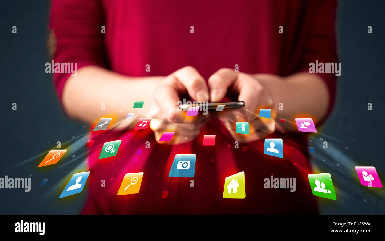 Man holding smartphone with technology application icons Stock Photo ...