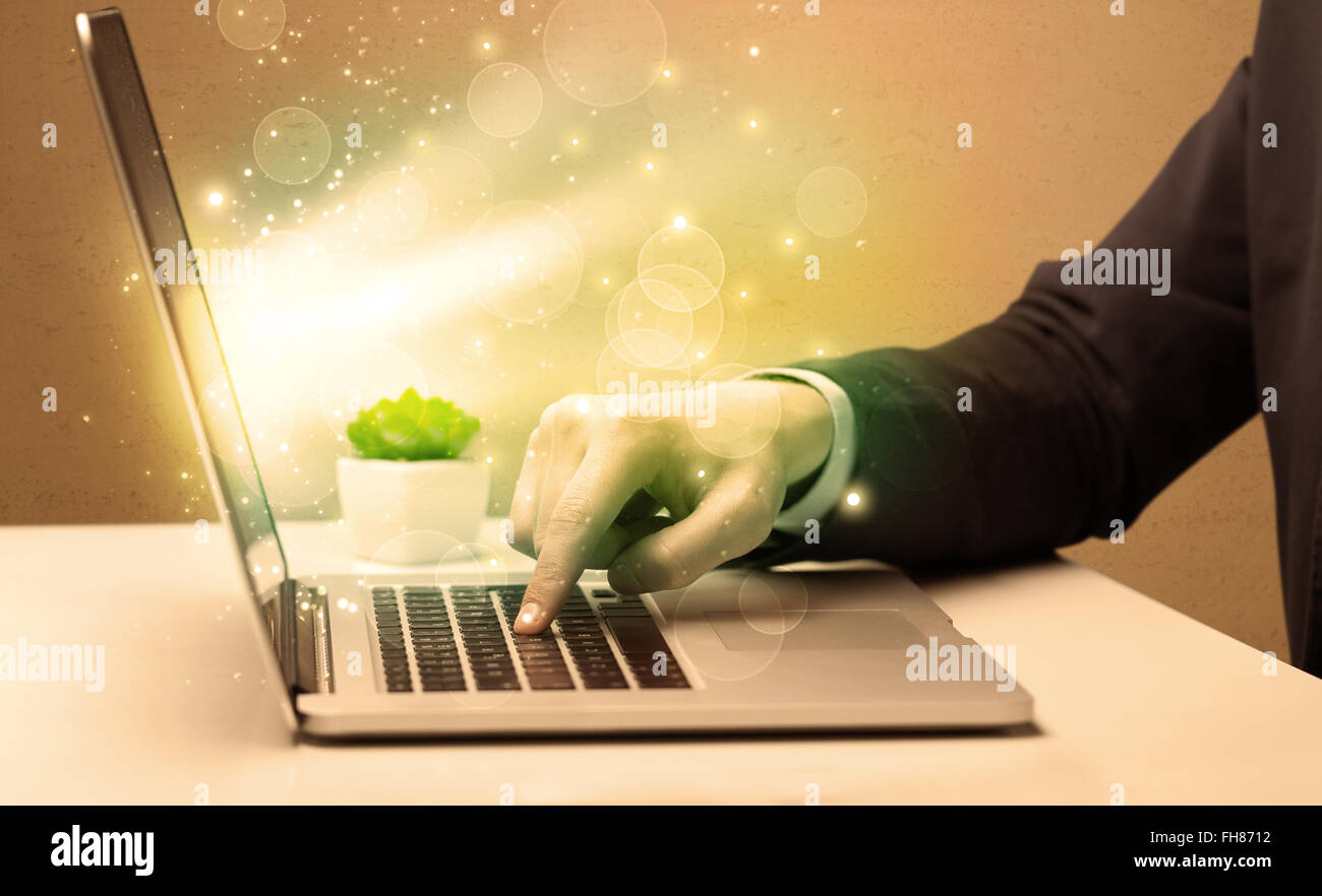 Businessman working fast on laptop Stock Photo - Alamy