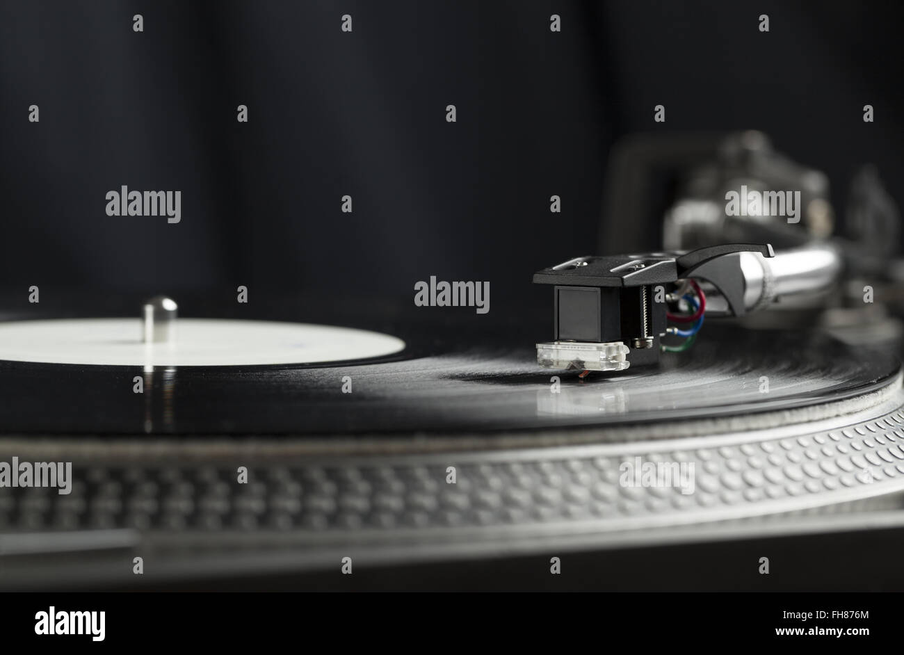 Turntable playing vinyl close up with needle on the record Stock Photo ...