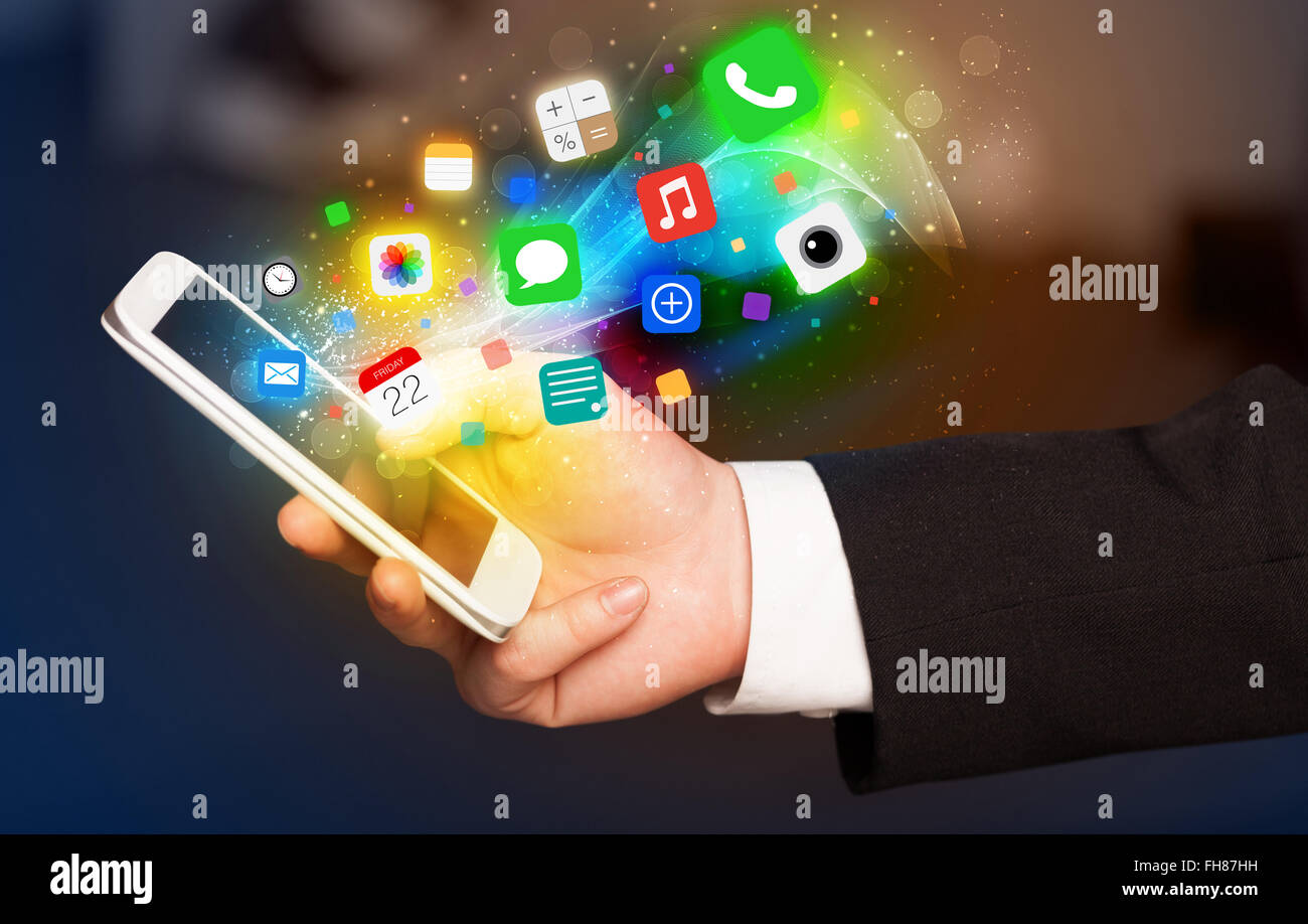 Hand holding smartphone with colorful app icons Stock Photo - Alamy