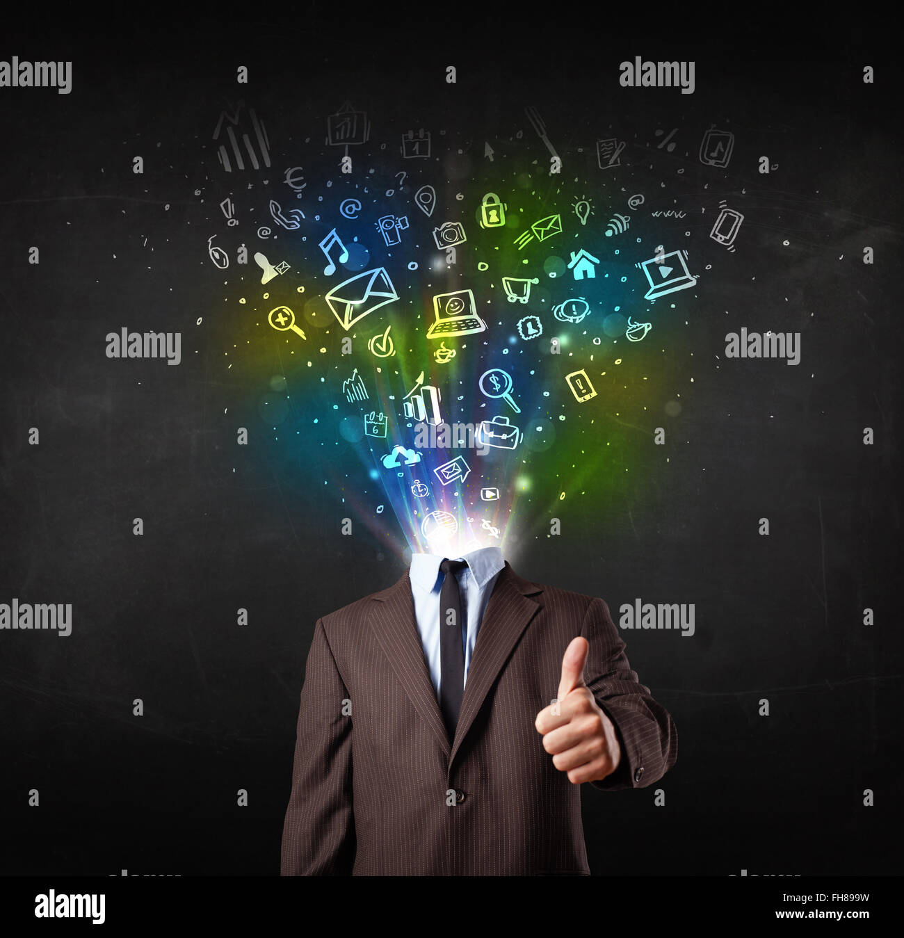 Business man with glowing media icons exploding head Stock Photo - Alamy