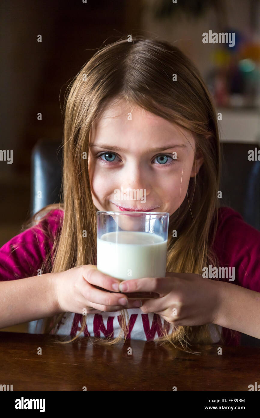 Portrait of girl drinking glass of milk Stock Photo Alamy
