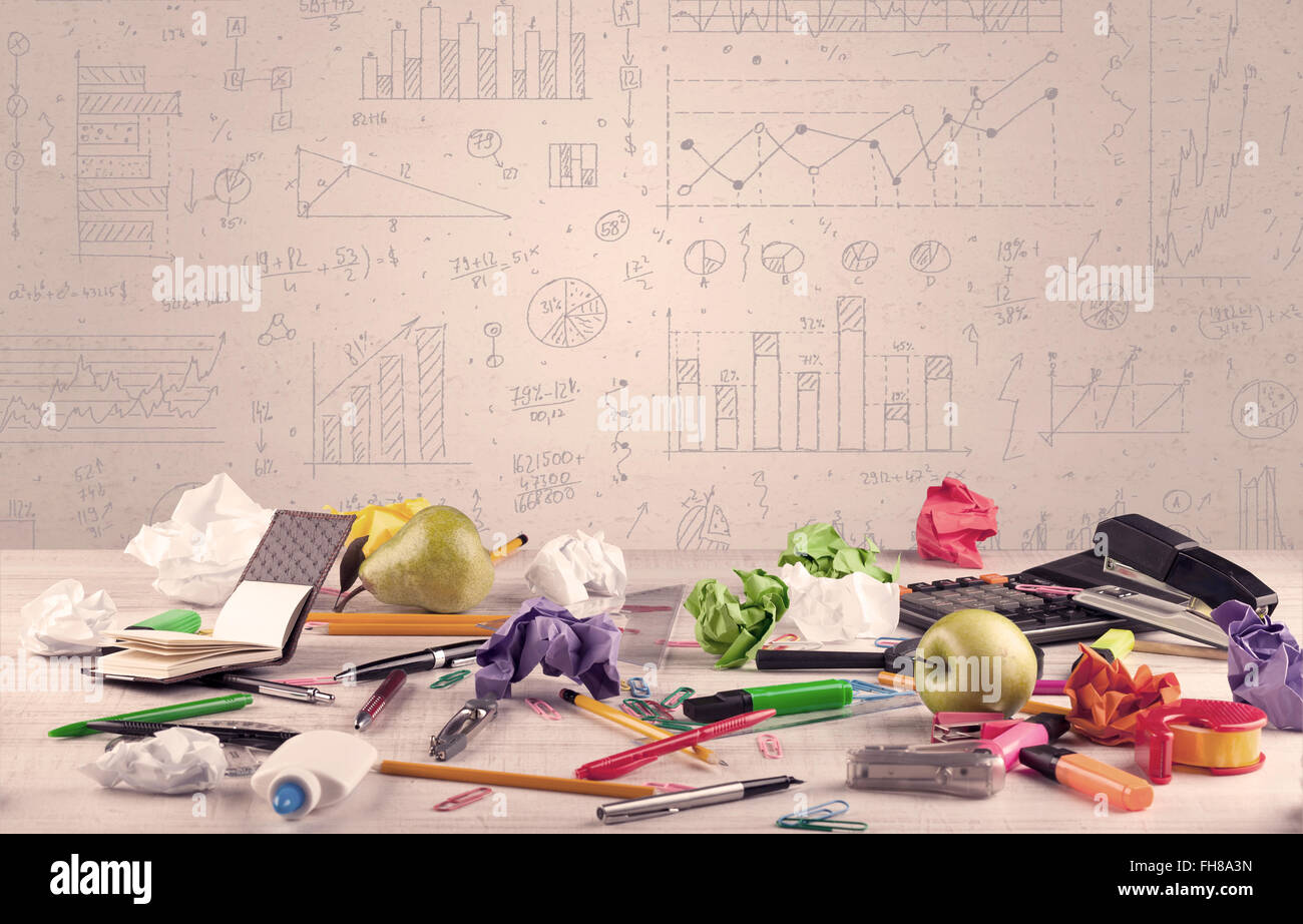 Graph charts and designer office desk Stock Photo - Alamy