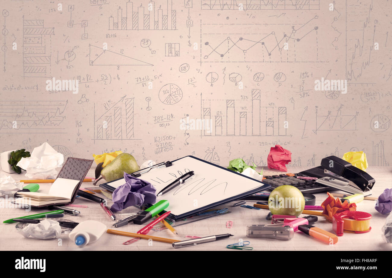 Graph charts and designer office desk Stock Photo - Alamy