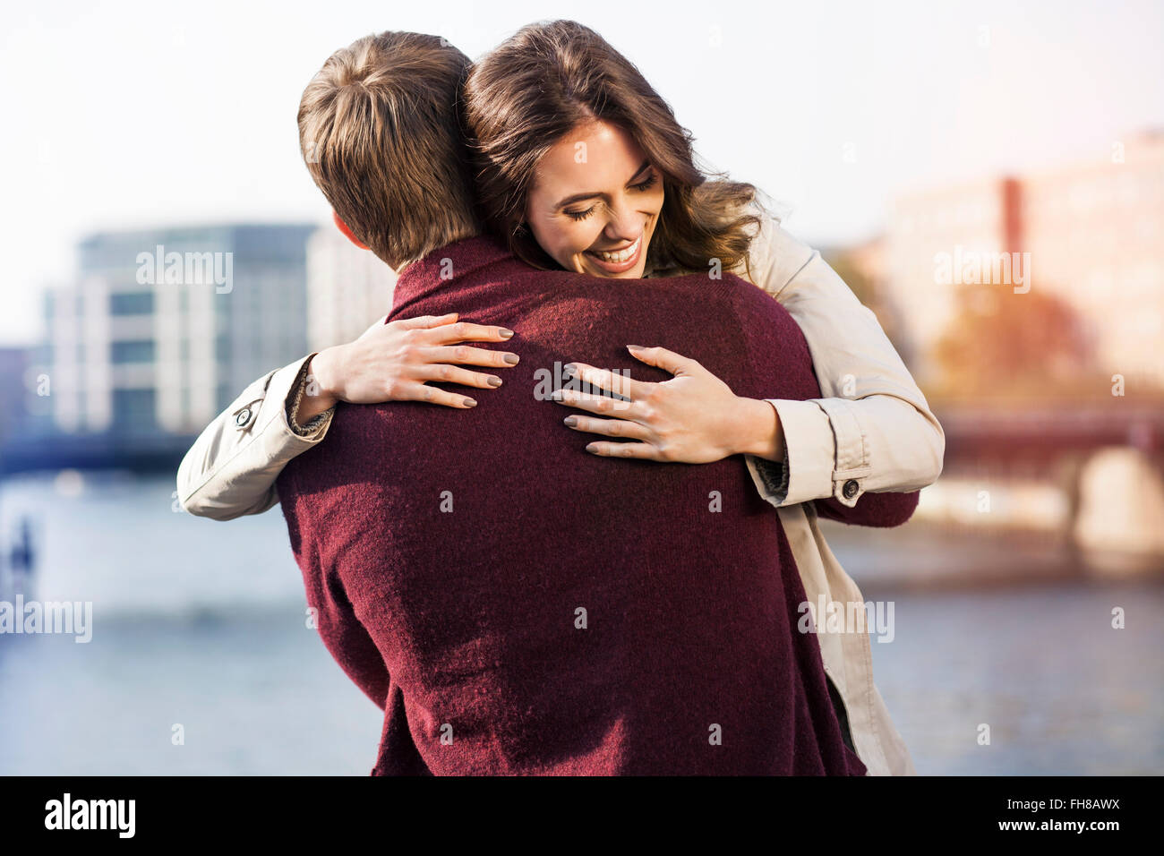 Young couple hugging riverside hi-res stock photography and images - Alamy