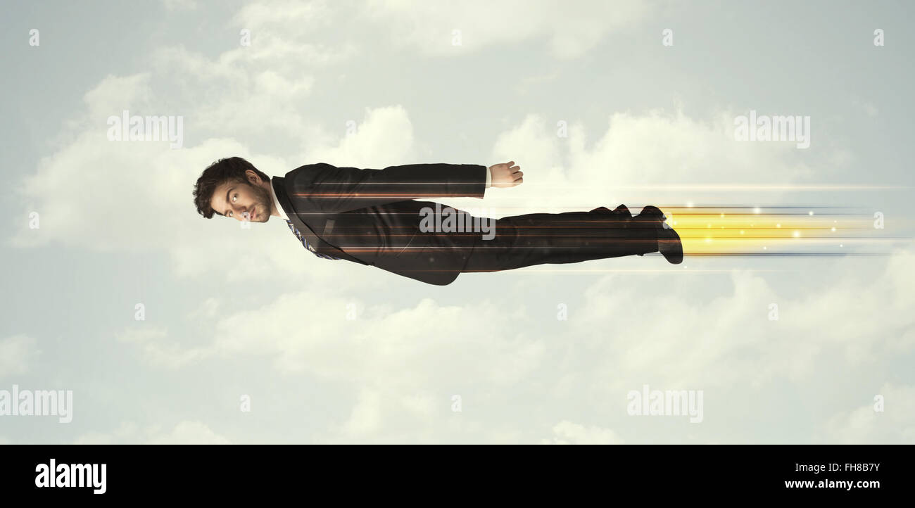 Happy business man flying fast on the sky between clouds Stock Photo ...