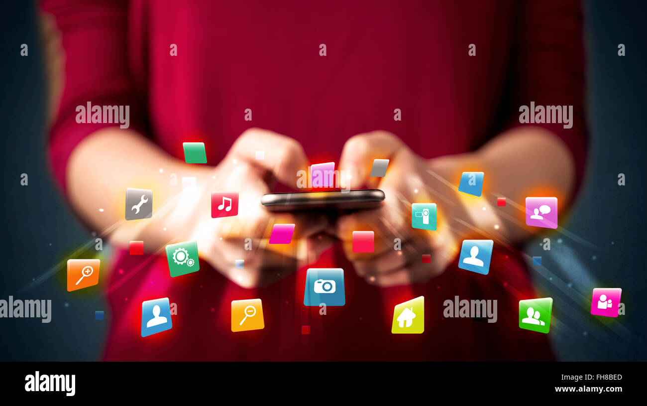 Man holding smartphone with technology application icons Stock Photo ...