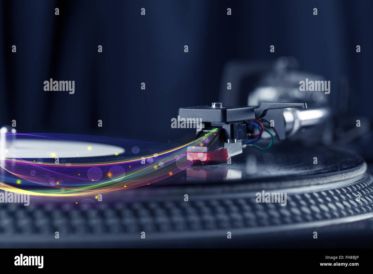 Turntable playing vinyl with glowing abstract lines Stock Photo - Alamy