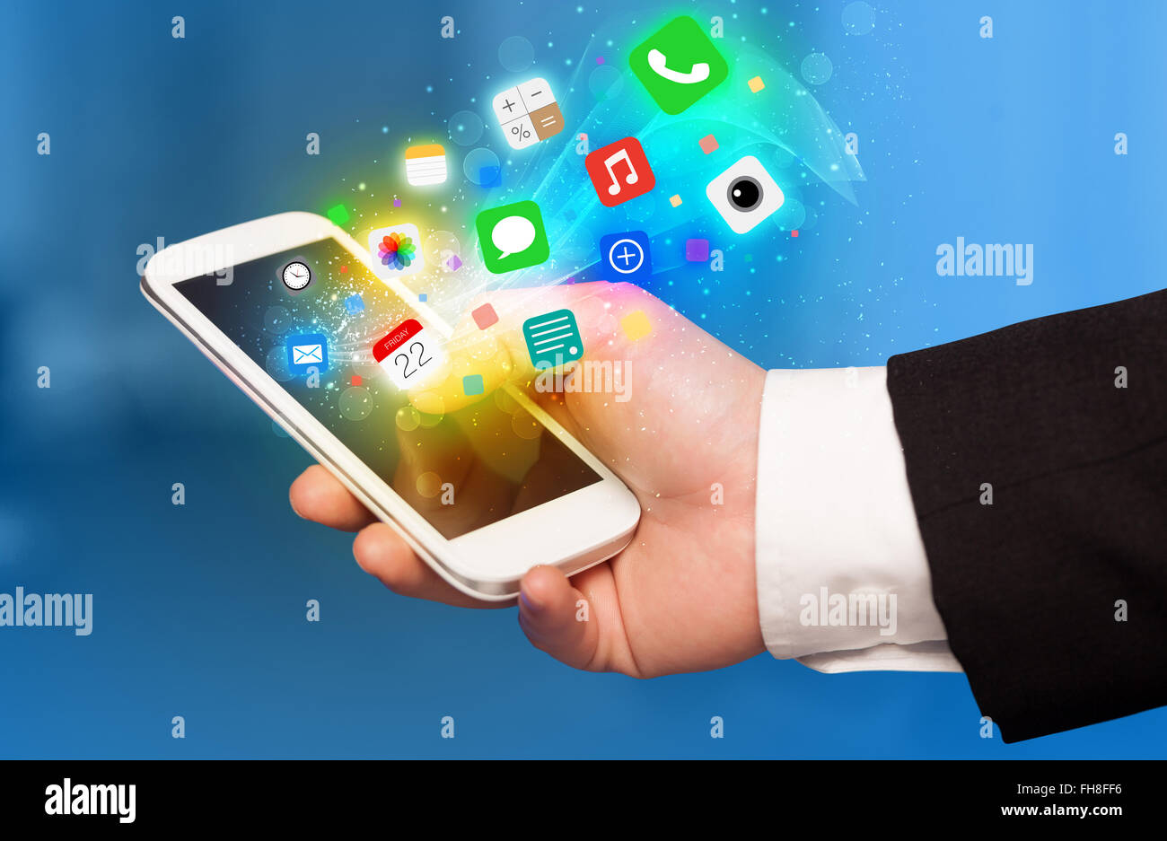 Hand holding smartphone with colorful app icons Stock Photo - Alamy