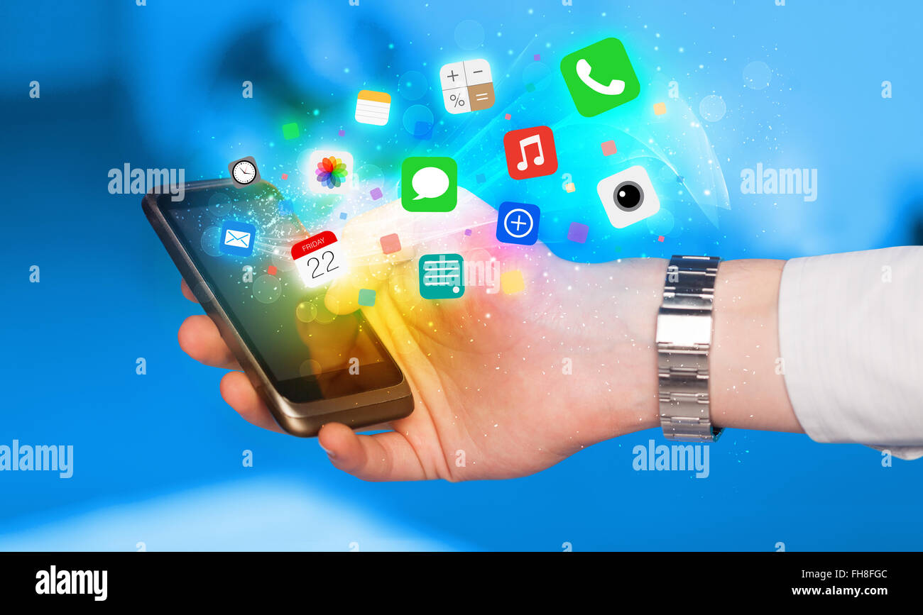 Hand holding smartphone with colorful app icons Stock Photo - Alamy