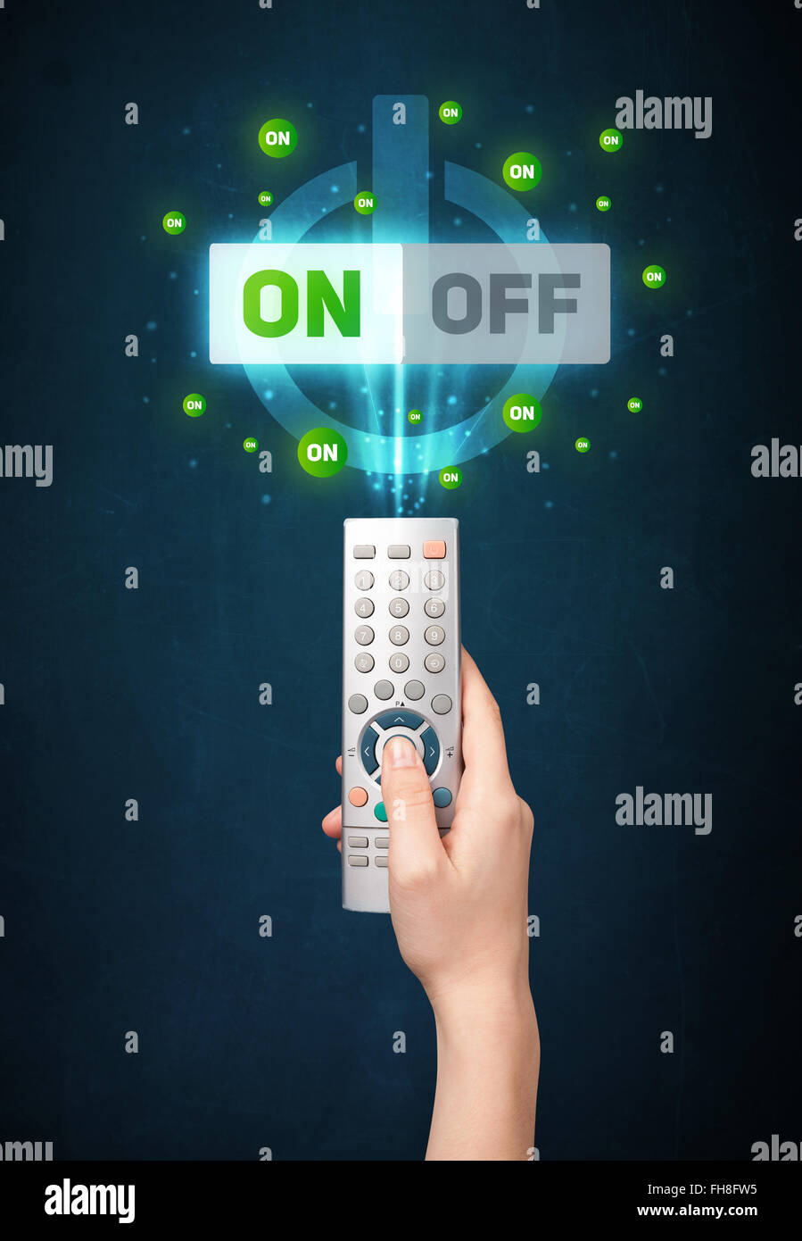 Hand with remote control and on-off signals Stock Photo - Alamy