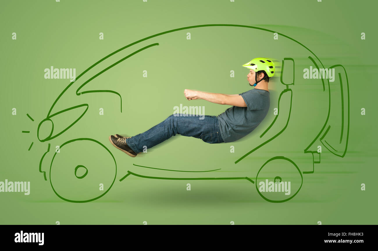 Man drives an eco friendy electric hand drawn car Stock Photo