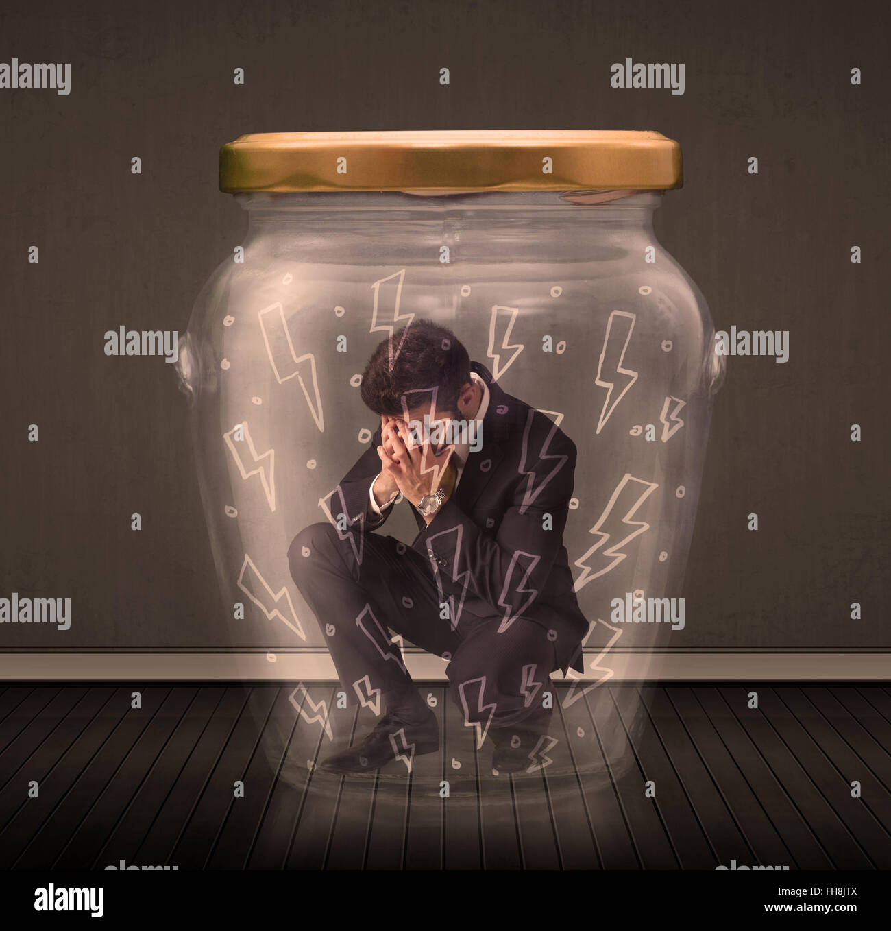 Businessman inside a glass jar with lightning drawings concept Stock Photo