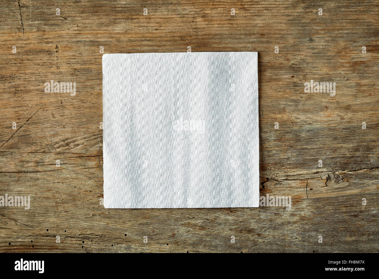 White paper napkin on wooden table, top view Stock Photo