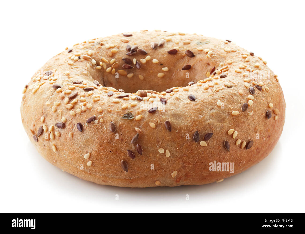Fullgrain bagel with seeds isolated on white background Stock Photo