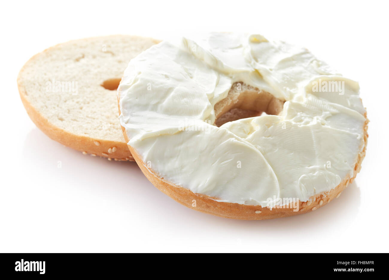 Sesame bagel with cream cheese isolated on white background Stock Photo