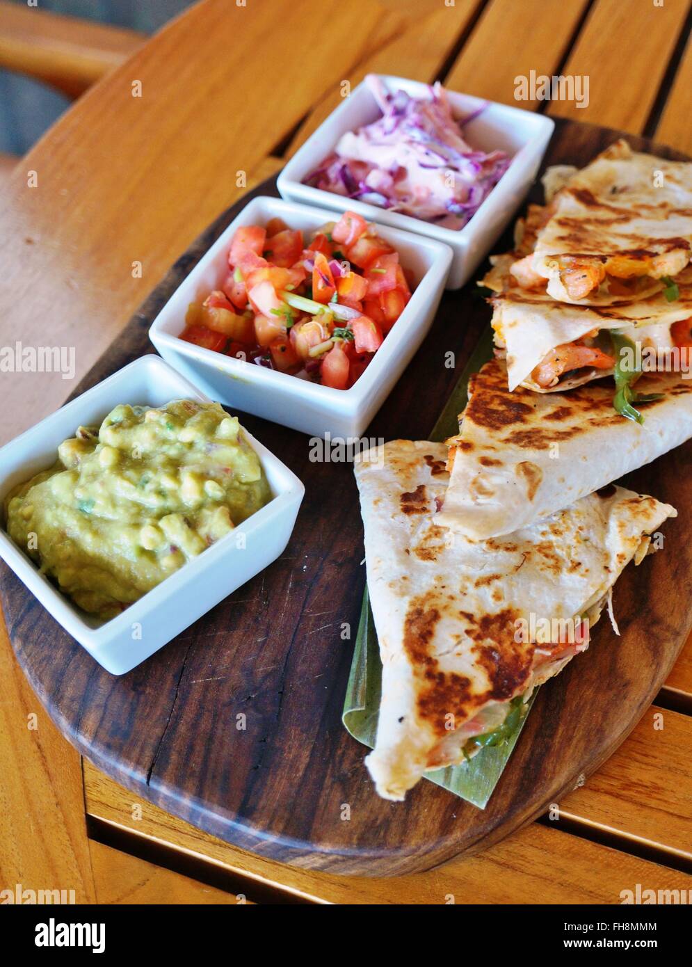 Shrimp quesadillas with guacamole and pico de gallo Stock Photo