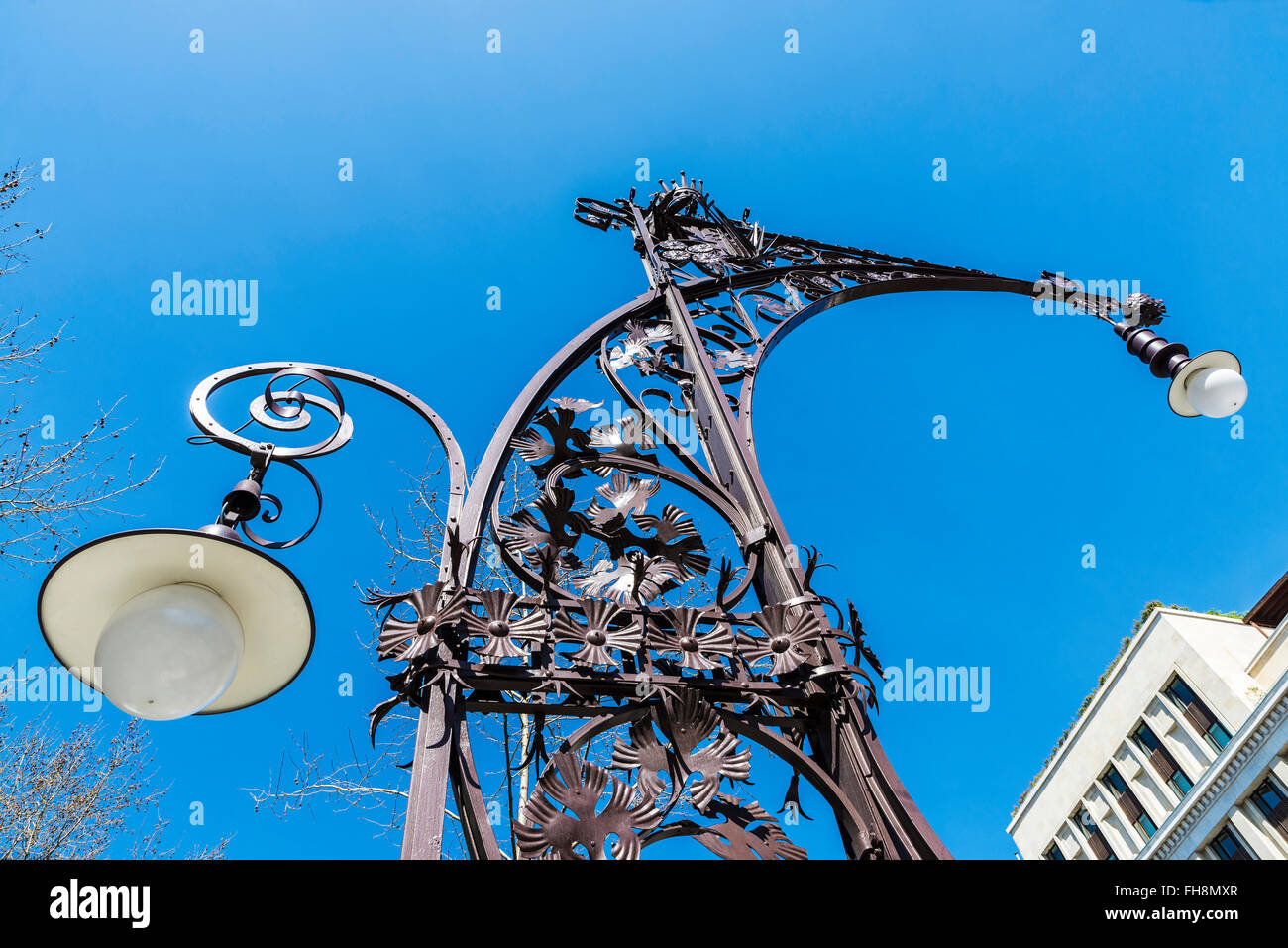 Modernist style streetlight, built in 1906 and recently restored on the Passeig de Gracia, Barcelona, Catalonia, Spain Stock Photo