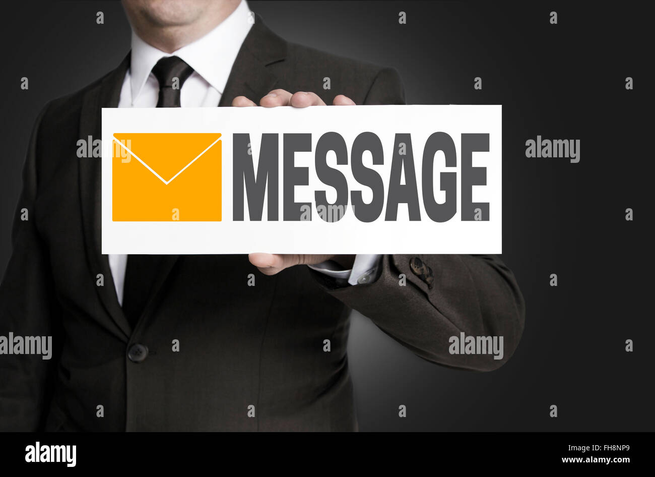 message sign is held by businessman. Stock Photo