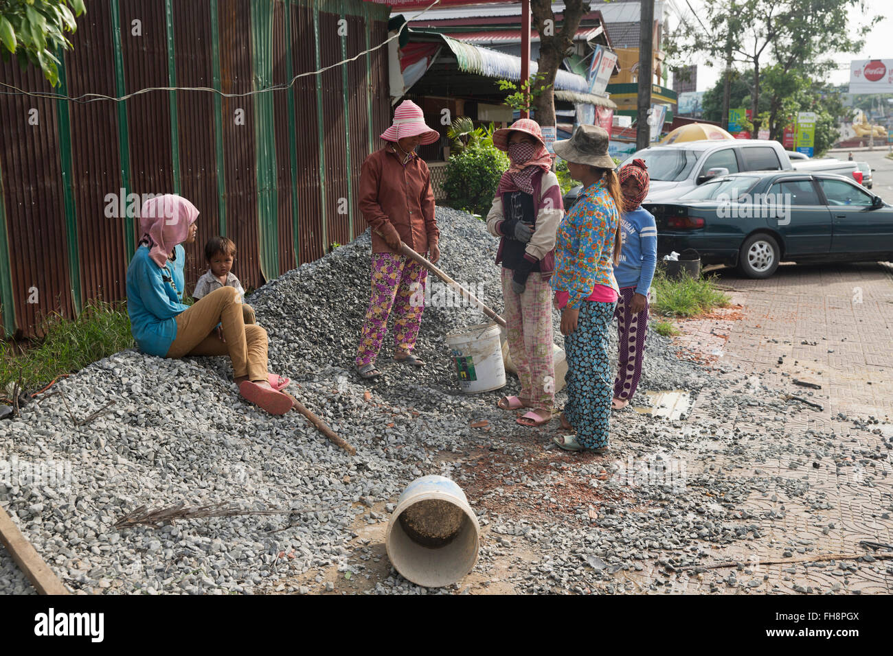 women labourers on side of the road in Sihanoukville, Cambodia Stock Photo