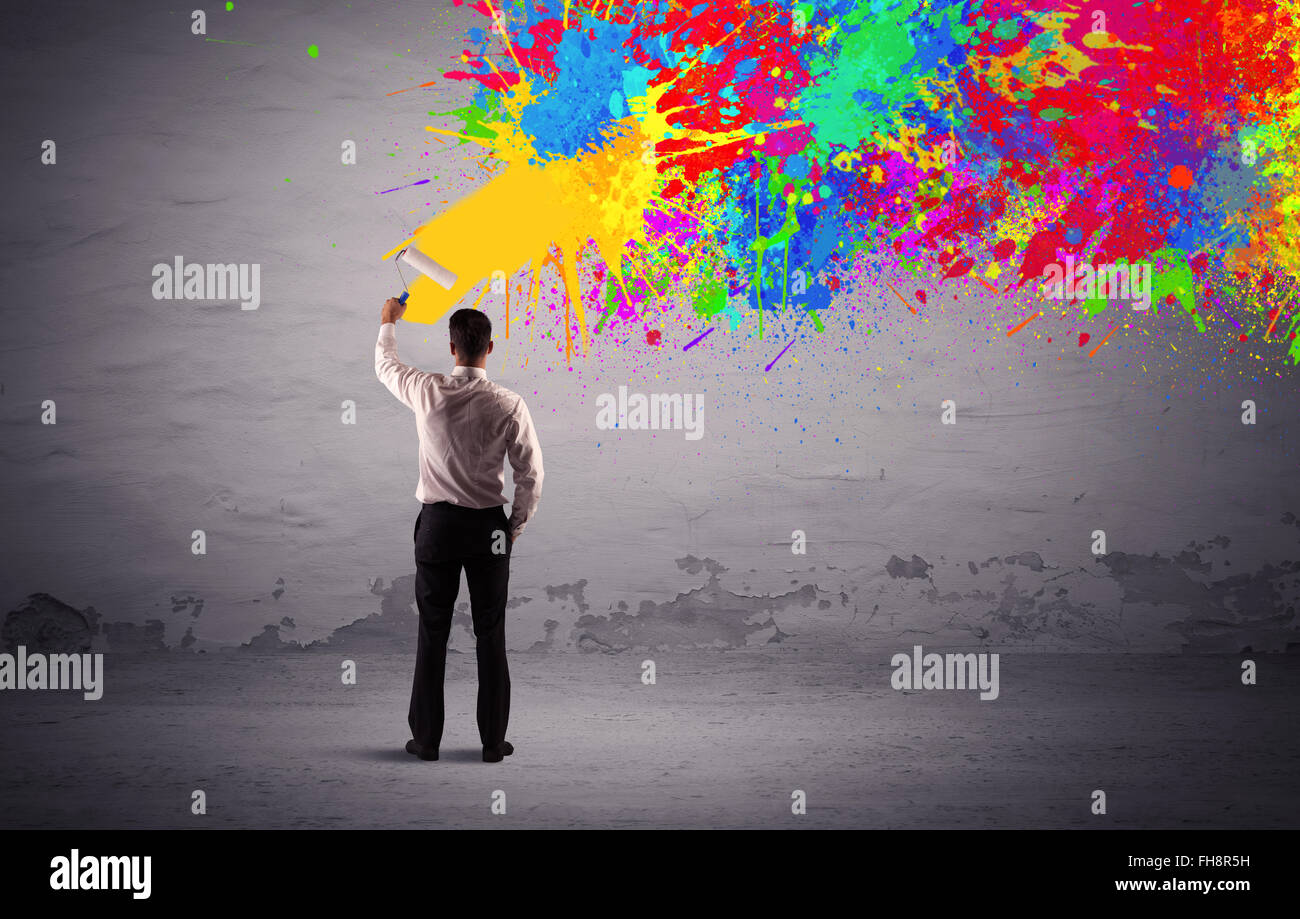 Sales person painting colorful splatter Stock Photo Alamy