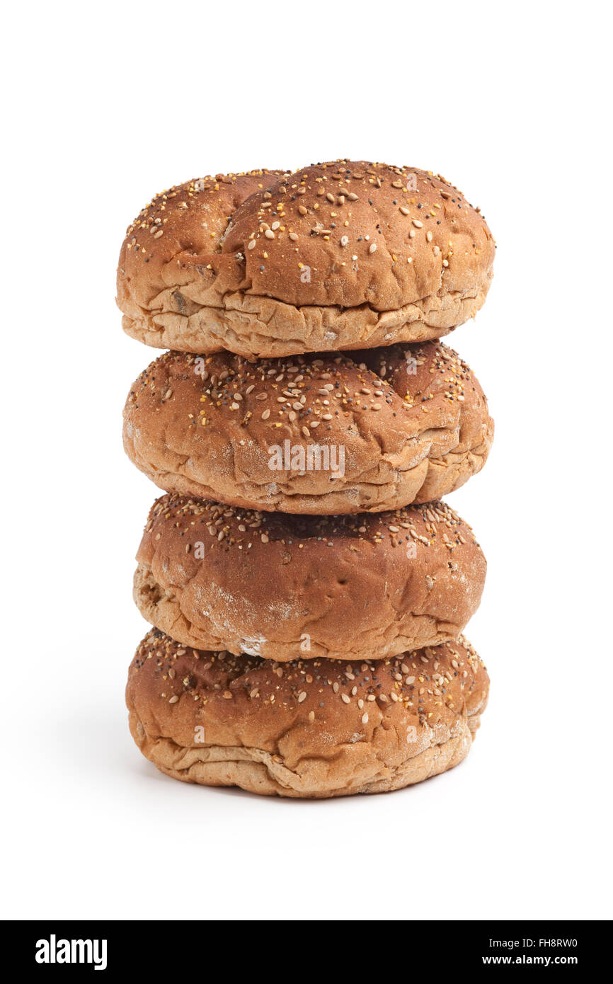 Fresh multi grain bread rolls on a pile on white background Stock Photo