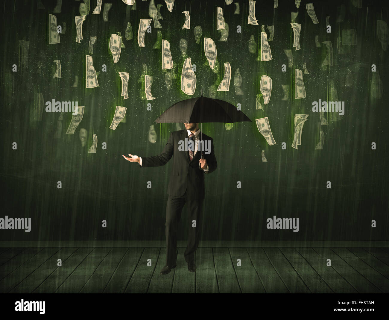 Businessman standing with umbrella in dollar bill rain concept Stock ...