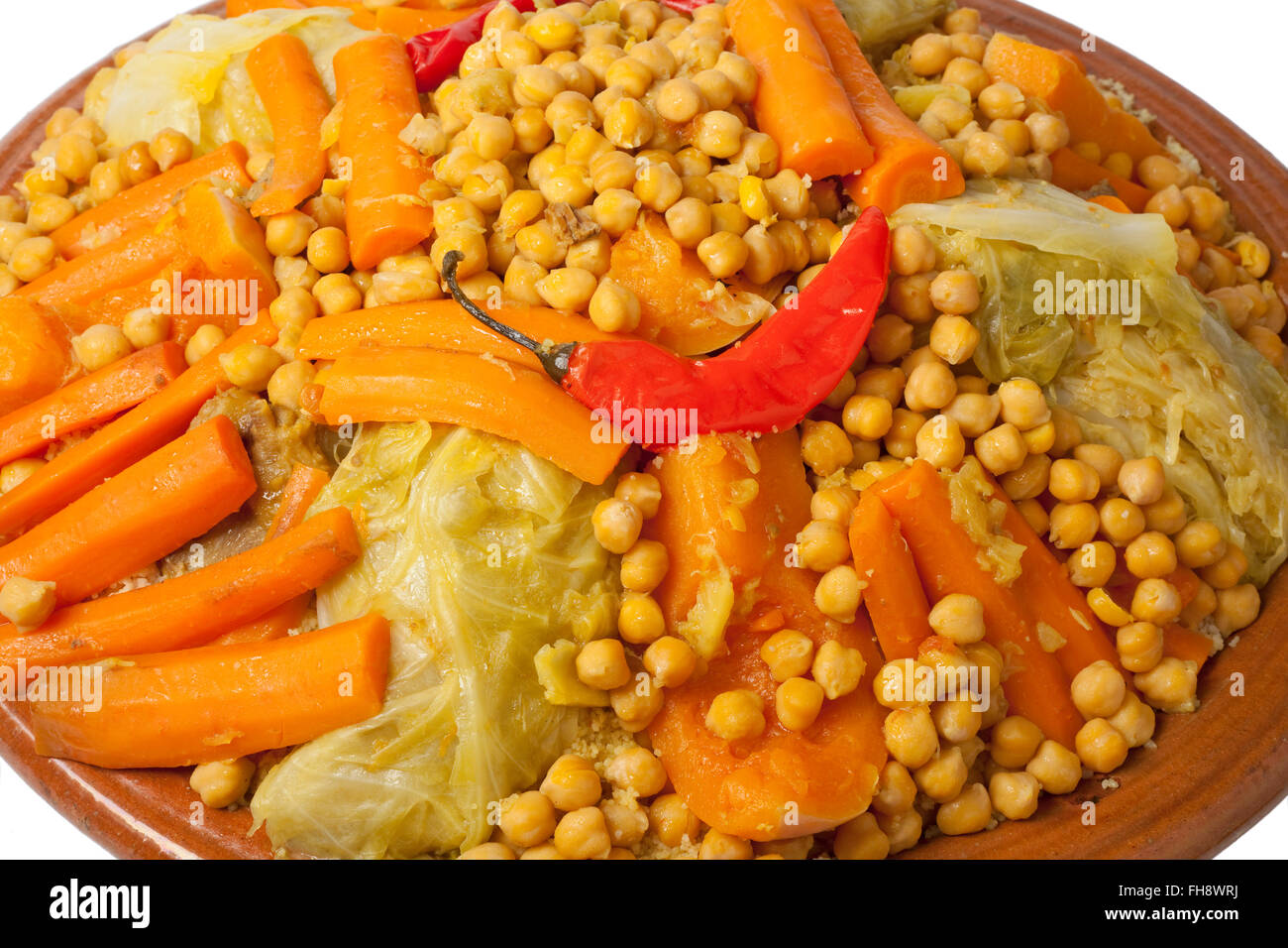 Traditional Moroccan dish with couscous close up on white background Stock Photo