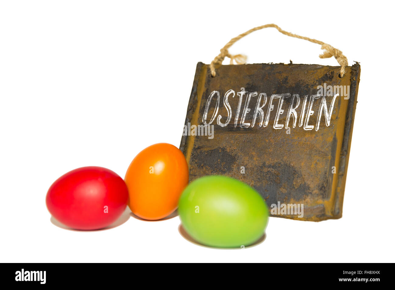 rustic sign with german word osterferien, which means easter vacation Stock Photo