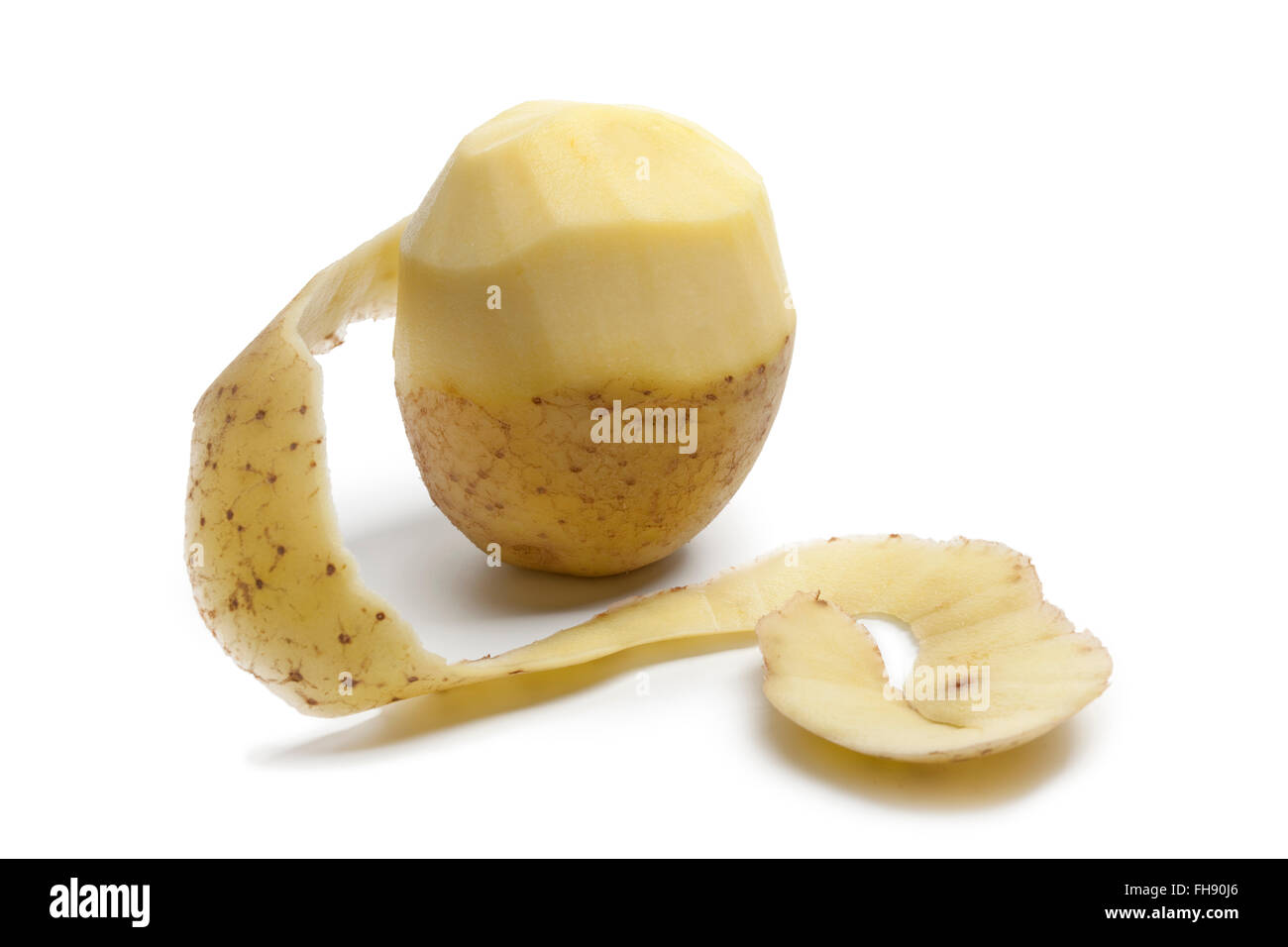 Fresh raw half peeled potato isolated on white background Stock Photo