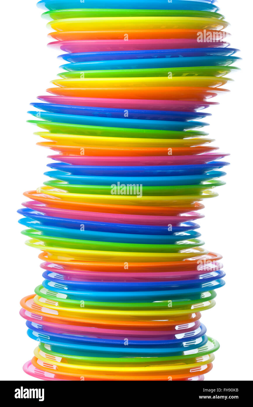 Rainbow colored plastic plates on white background Stock Photo Alamy