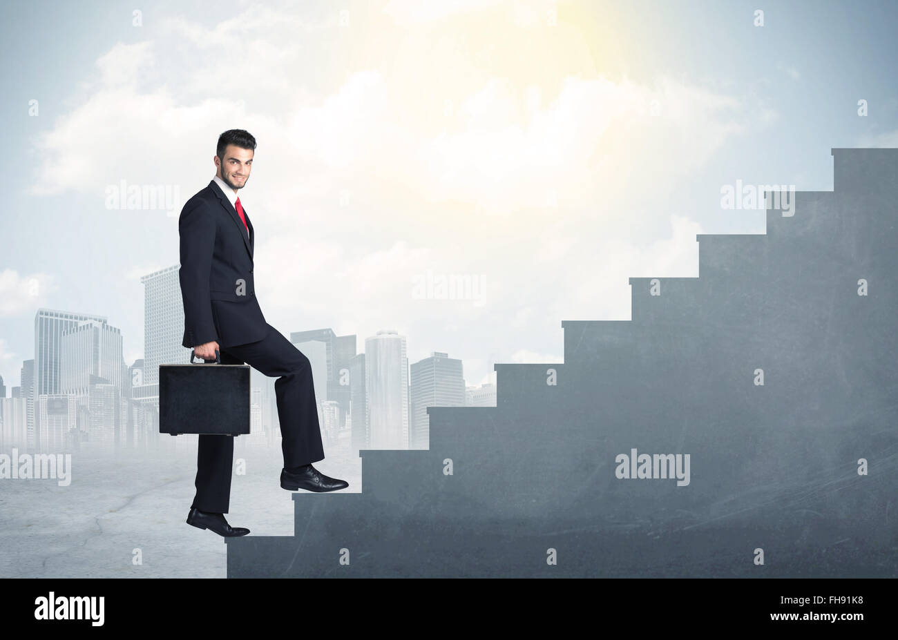 Businessman climbing up a concrete staircase concept Stock Photo - Alamy