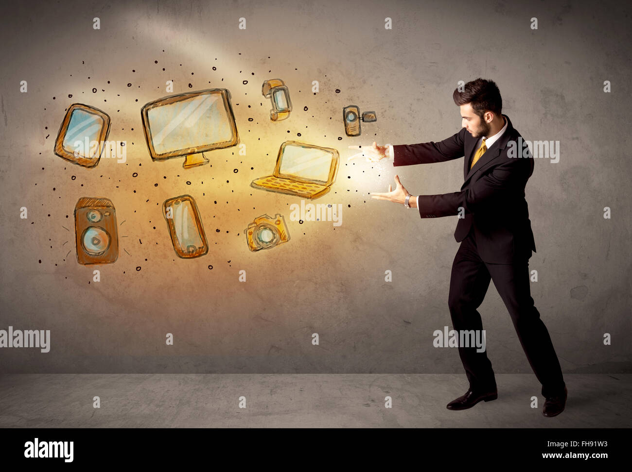 Man throwing hand drawn electronical devices Stock Photo