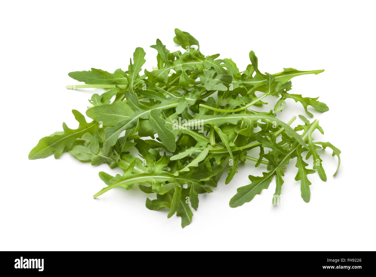 Heap of fresh raw Arugula leaves on white background Stock Photo