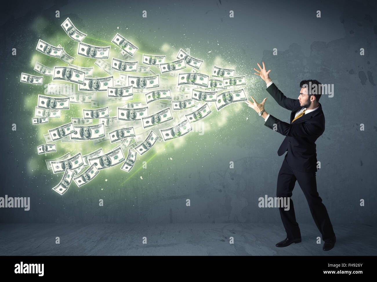 Business person throwing a lot of dollar bills concept Stock Photo