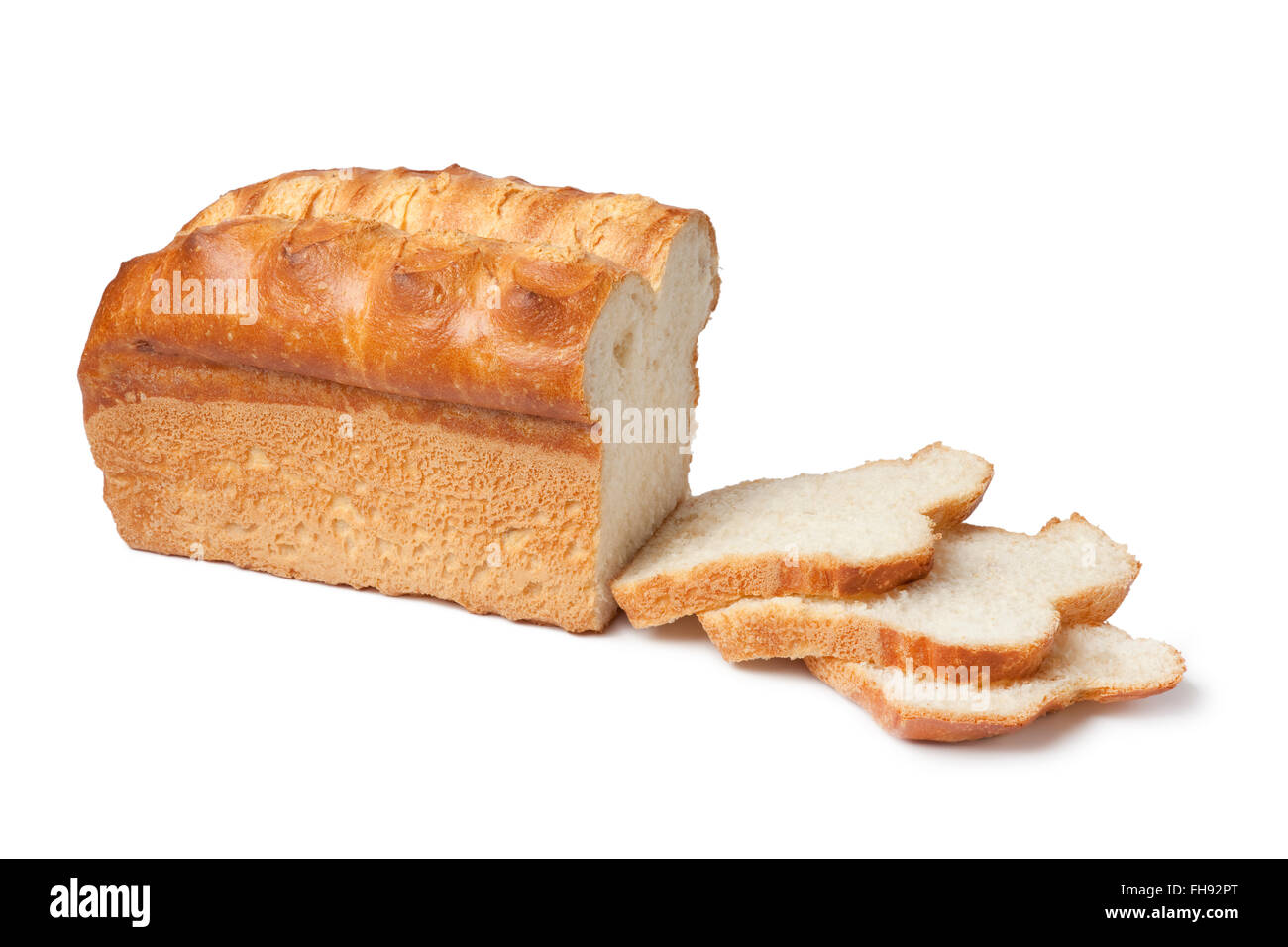 Loaf of fresh white bread with slices on white background Stock Photo