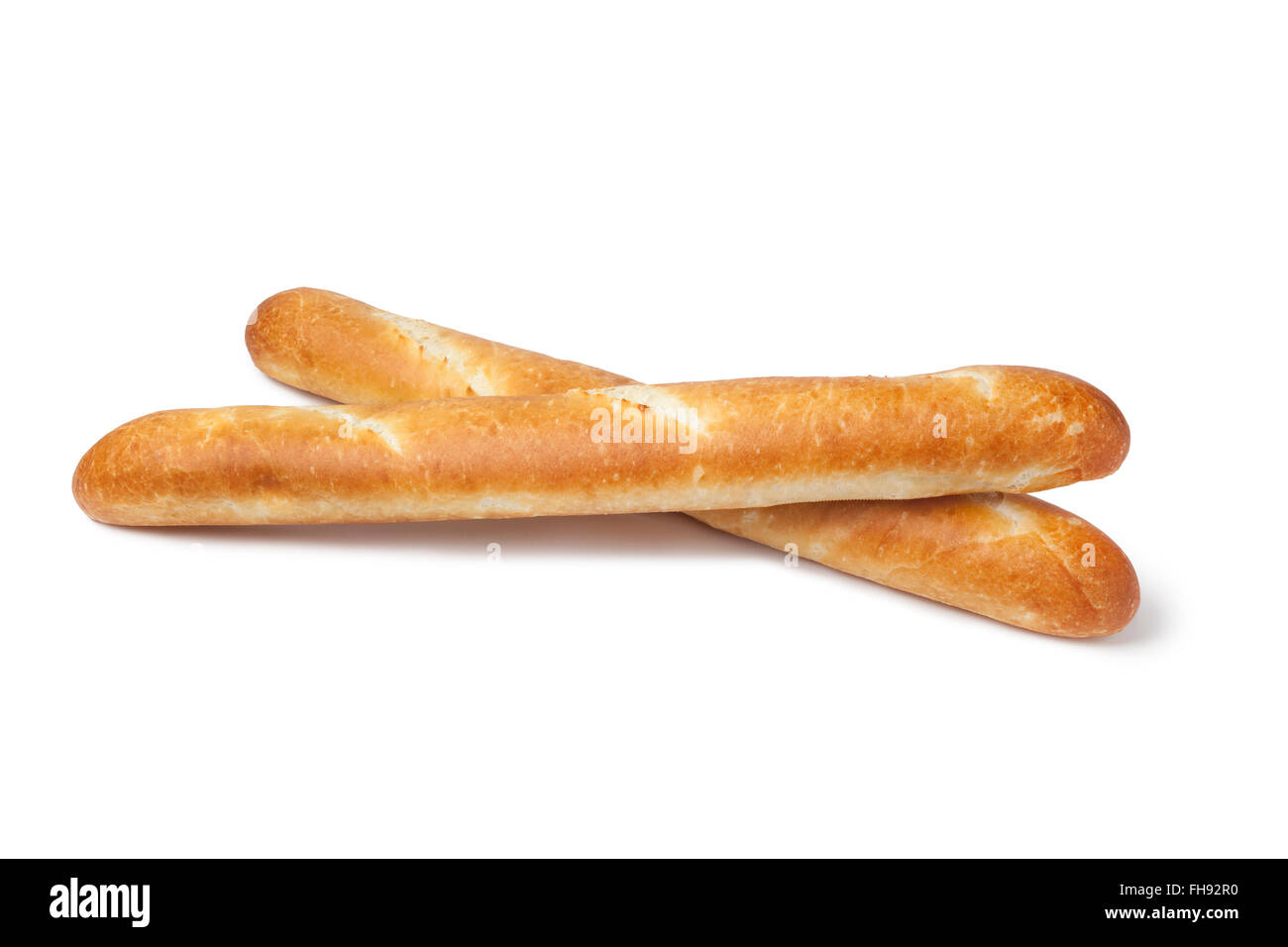 Two whole fresh French bread, baguettes on white background Stock Photo