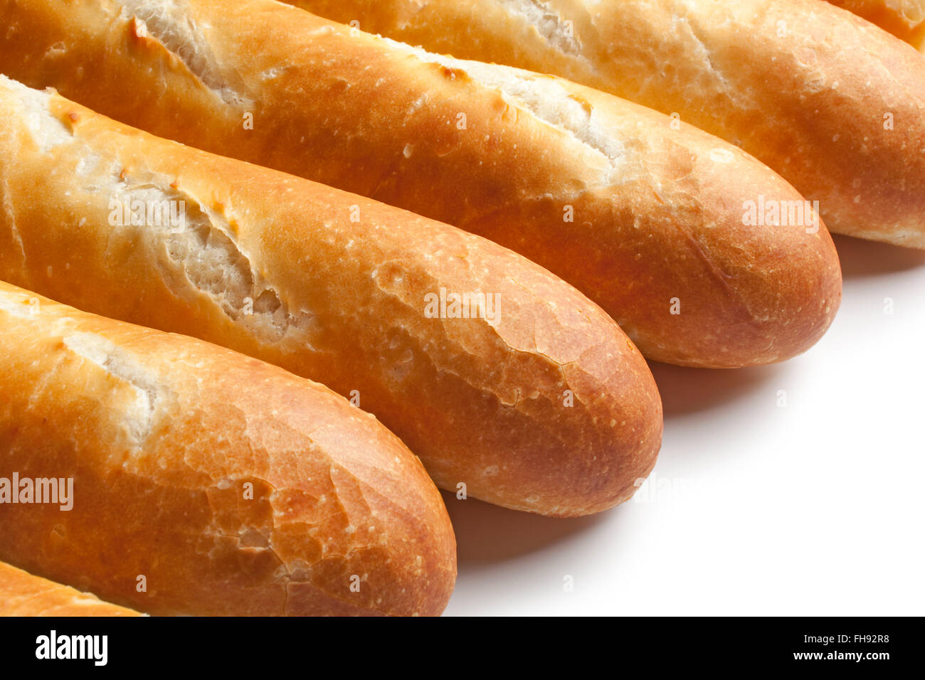 Fresh french bread, baguettes close up on white background Stock Photo