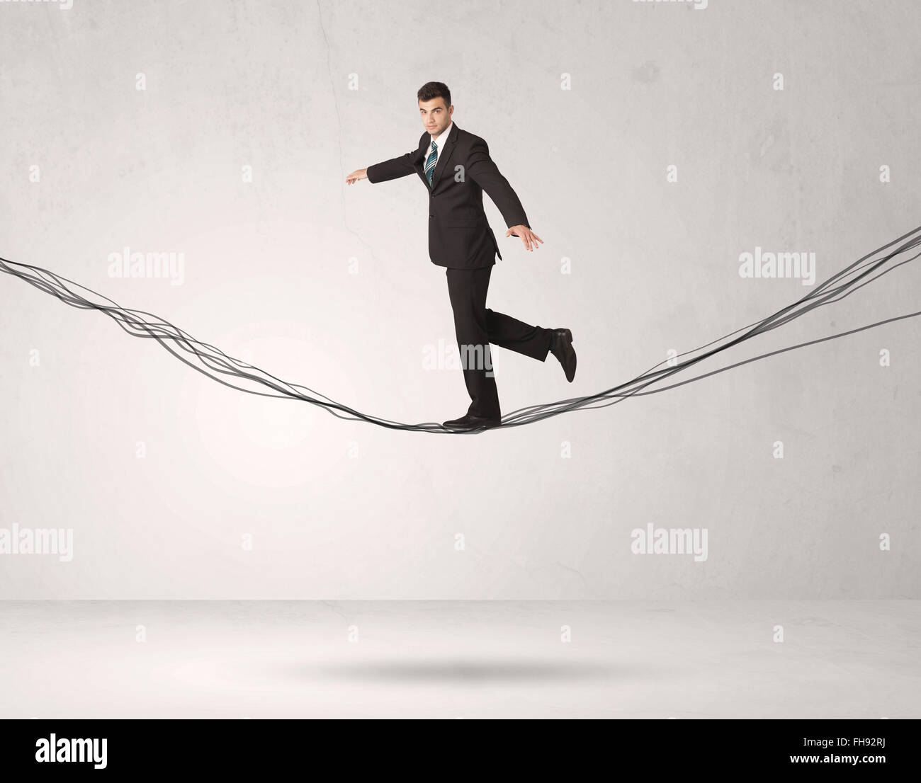 Balance In Rope Tightrope suit walking balancing hi-res stock photography and images ...