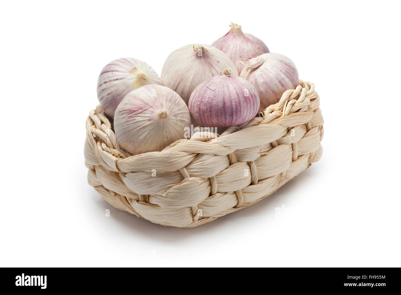 Basket with whole fresh single clove garlic on white background Stock ...