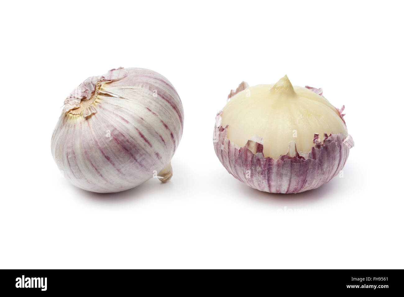 Whole fresh single clove garlic on white background Stock Photo