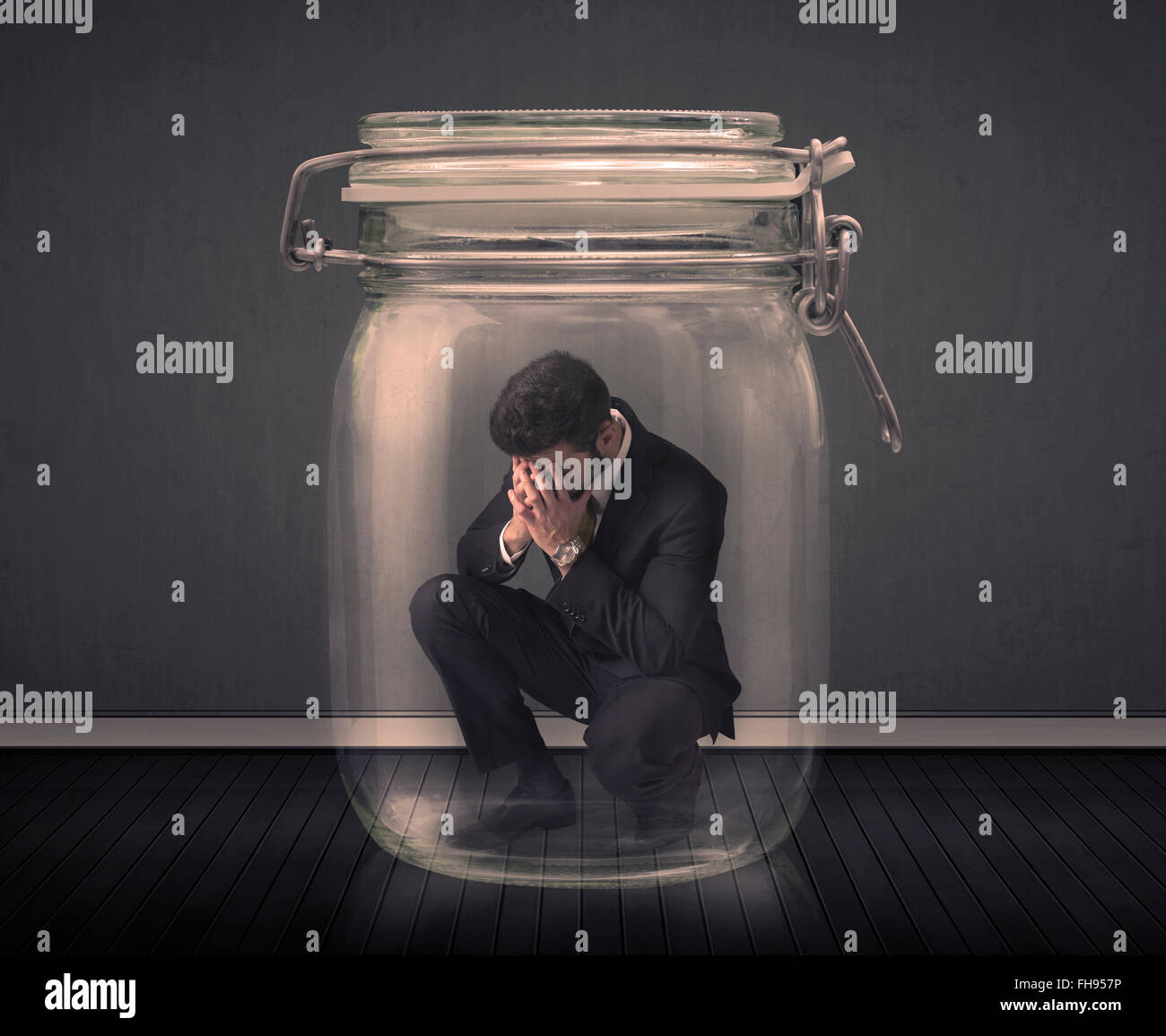 Trapped In Glass Businessman trapped into a glass jar concept Stock Photo - Alamy