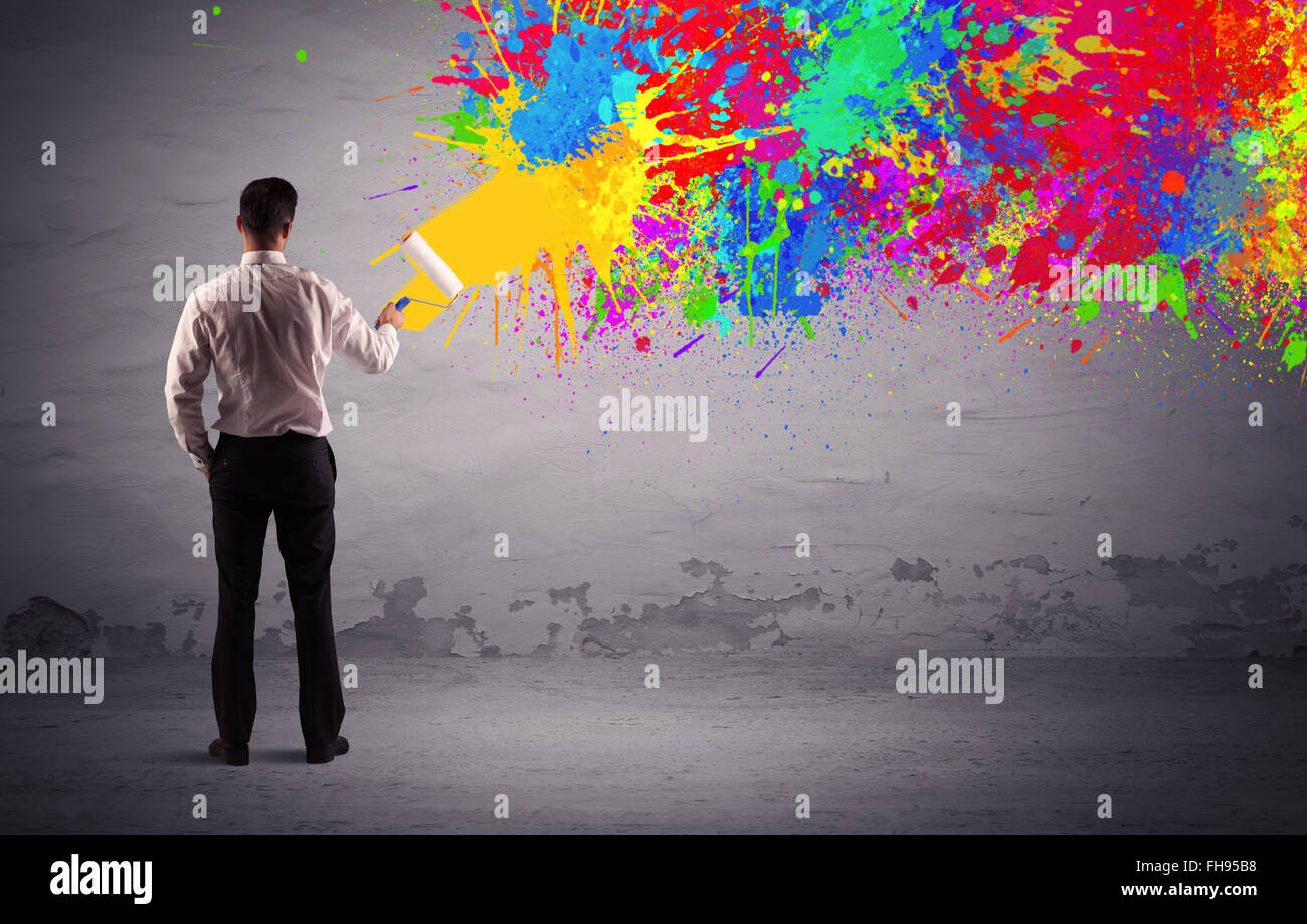 Sales person painting colorful splatter Stock Photo Alamy