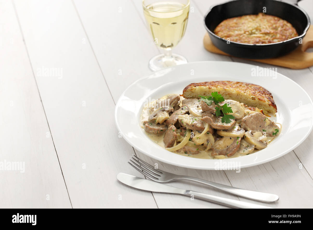 Zurich style veal stew and rosti potato, Swiss cuisine Stock Photo