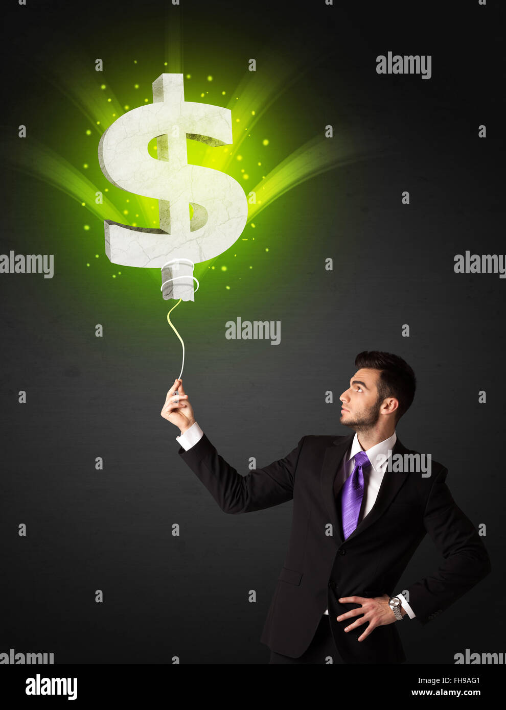 Businessman with a dollar sign balloon Stock Photo - Alamy